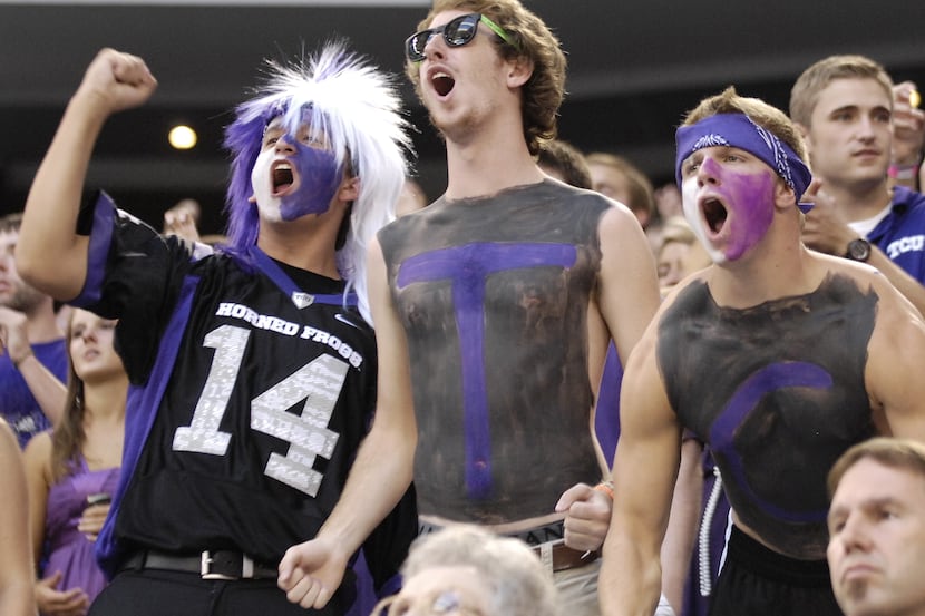 TCU fans cheer on the Frogs as TCU beat Oregon State 30 to 21 in "The Cowboys Classic," at...
