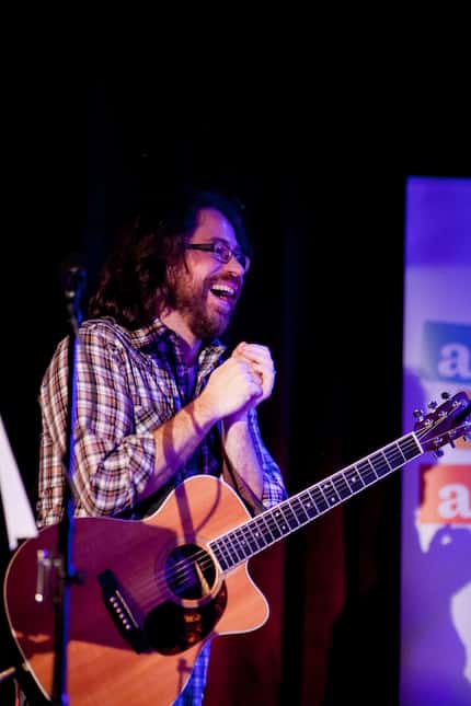 Musician Jonathan Coulton laughs while delivering the tunes on Ask Me Another. (Steve...