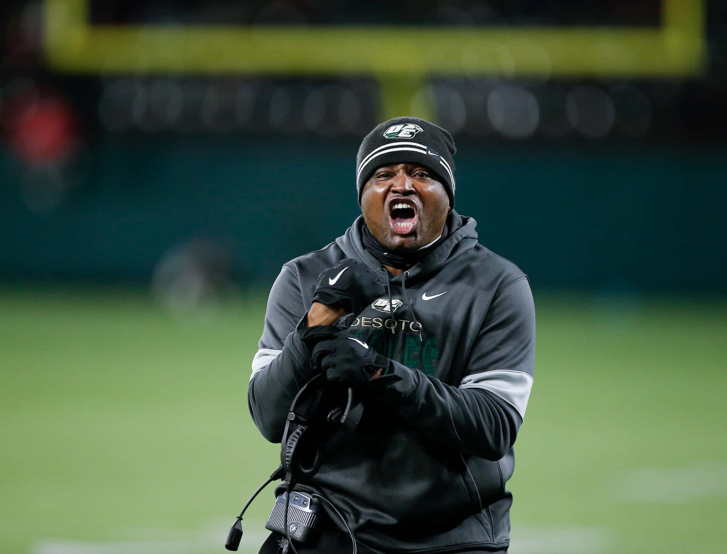 DeSoto head coach Claude Mathis argues for a holding call during the first half of a Class...