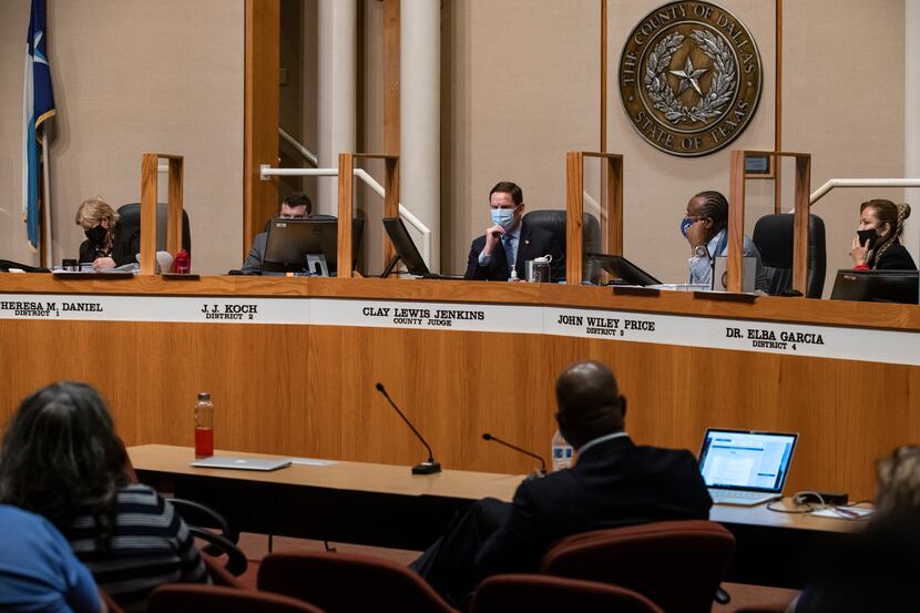 Dallas County Judge Clay Jenkins (center) and county commissioners listened to a...