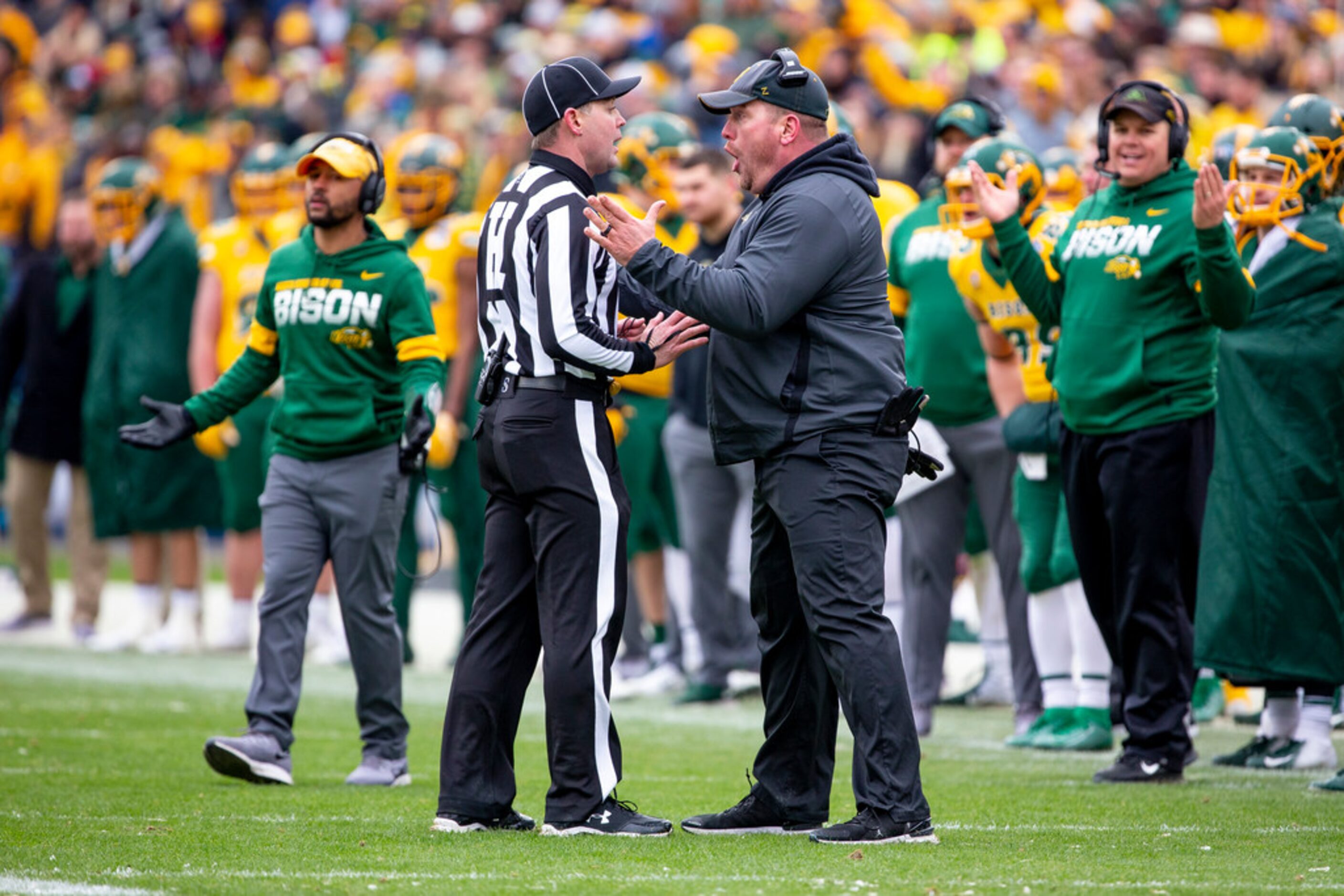 North Dakota State head coach Matt Entz speaks with an official after a touchdown scored by...