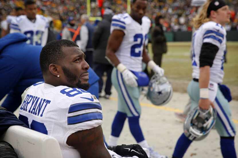 Dallas Cowboys wide receiver Dez Bryant (88) sits alone on the bench as the remaining...