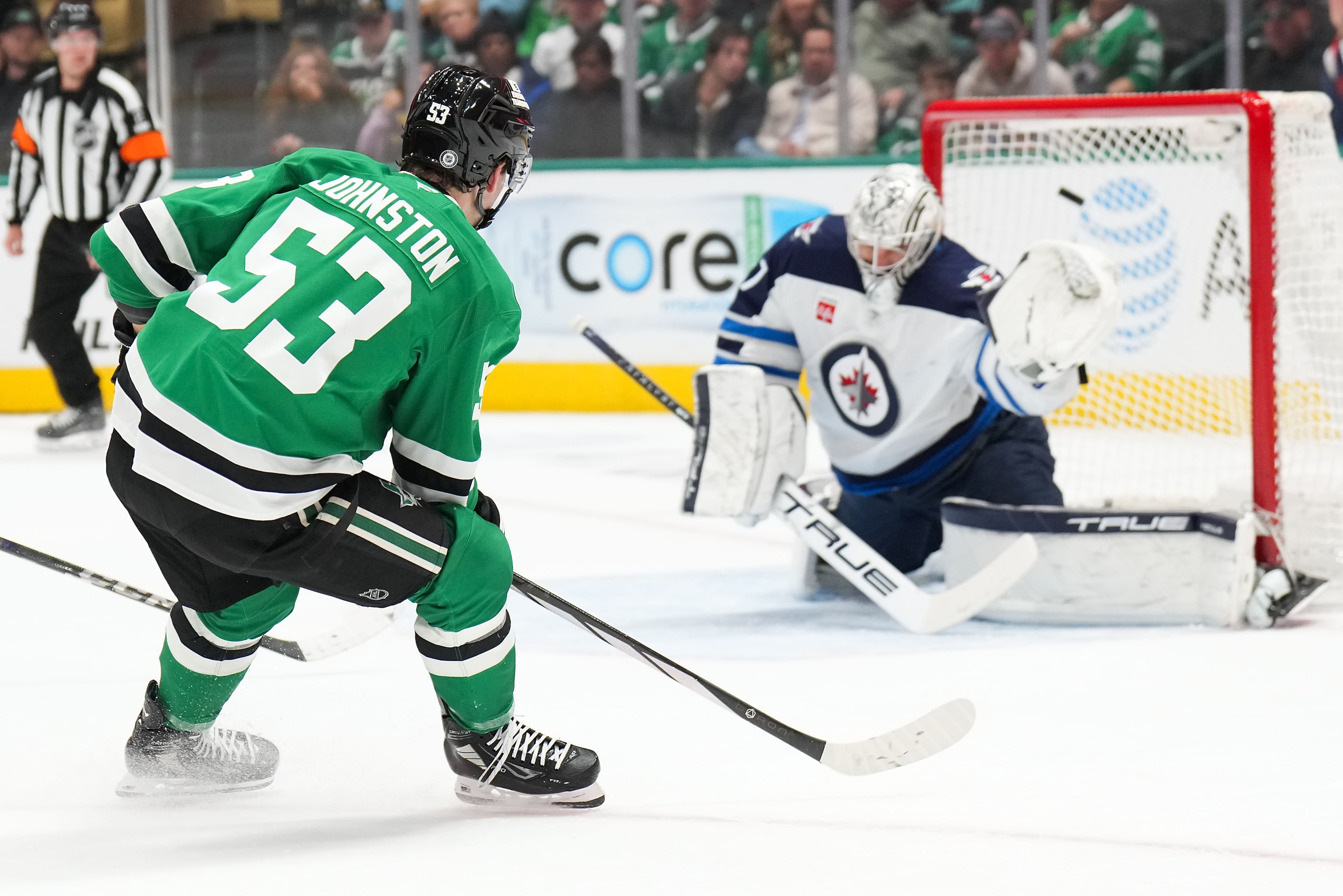 Dallas Stars center Wyatt Johnston (53) scores against Winnipeg Jets goaltender Connor...