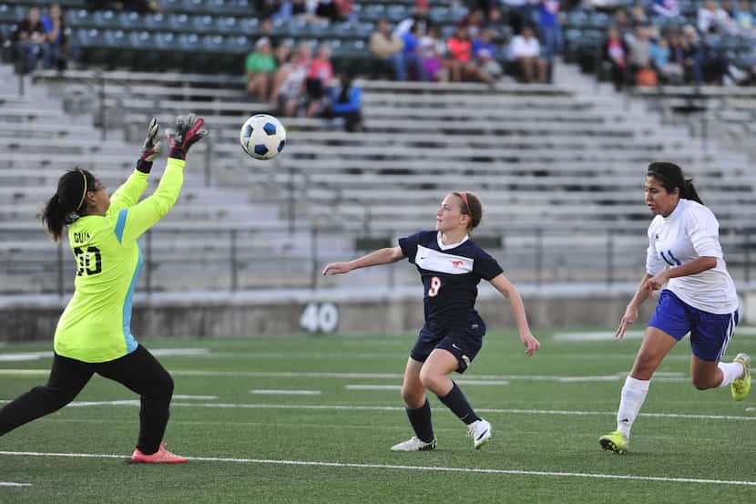 North Mesquite's goalkeeper Jennette Guia (left) goes to grab the ball before Sachse's...
