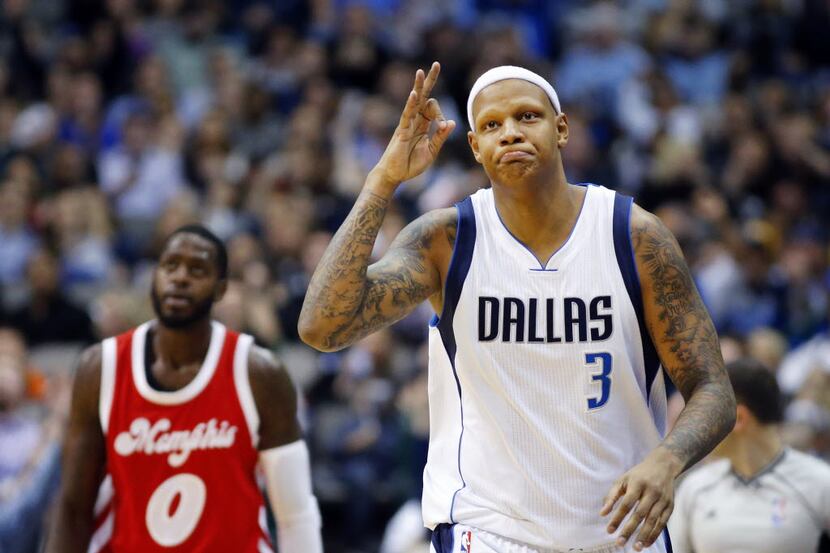 Dallas Mavericks forward Charlie Villanueva (3) flashes three fingers after hitting another...