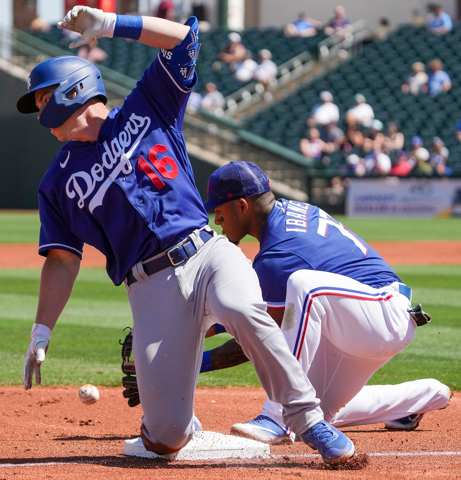 Los Angeles Dodgers catcher Will Smith is safe at third base with a triple ahead of the...