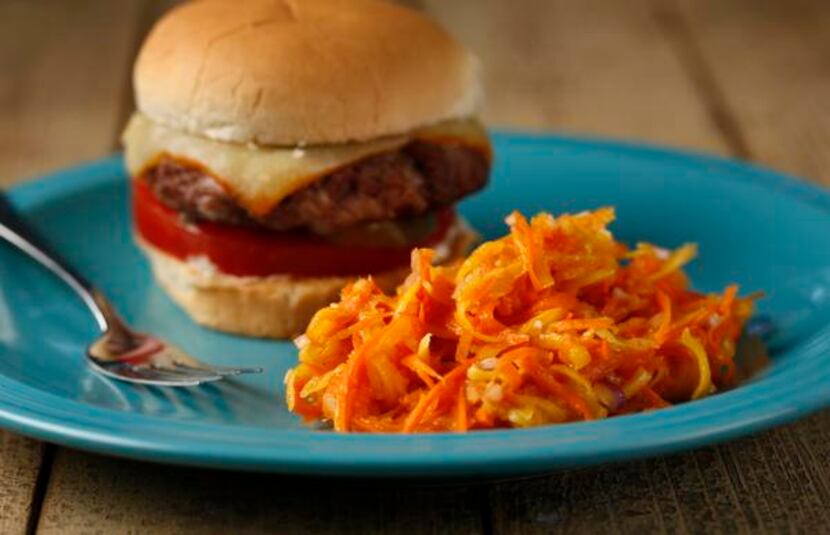 
Ginger Mango Carrot Slaw is a spicy partner for the Oink and Moo Burger. 
