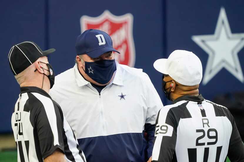 Dallas Cowboys head coach Mike McCarthy talks with officials before an NFL football game...