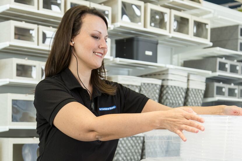  Employees at The Container Store use voice-activated wearable devices made by Theatro, a...