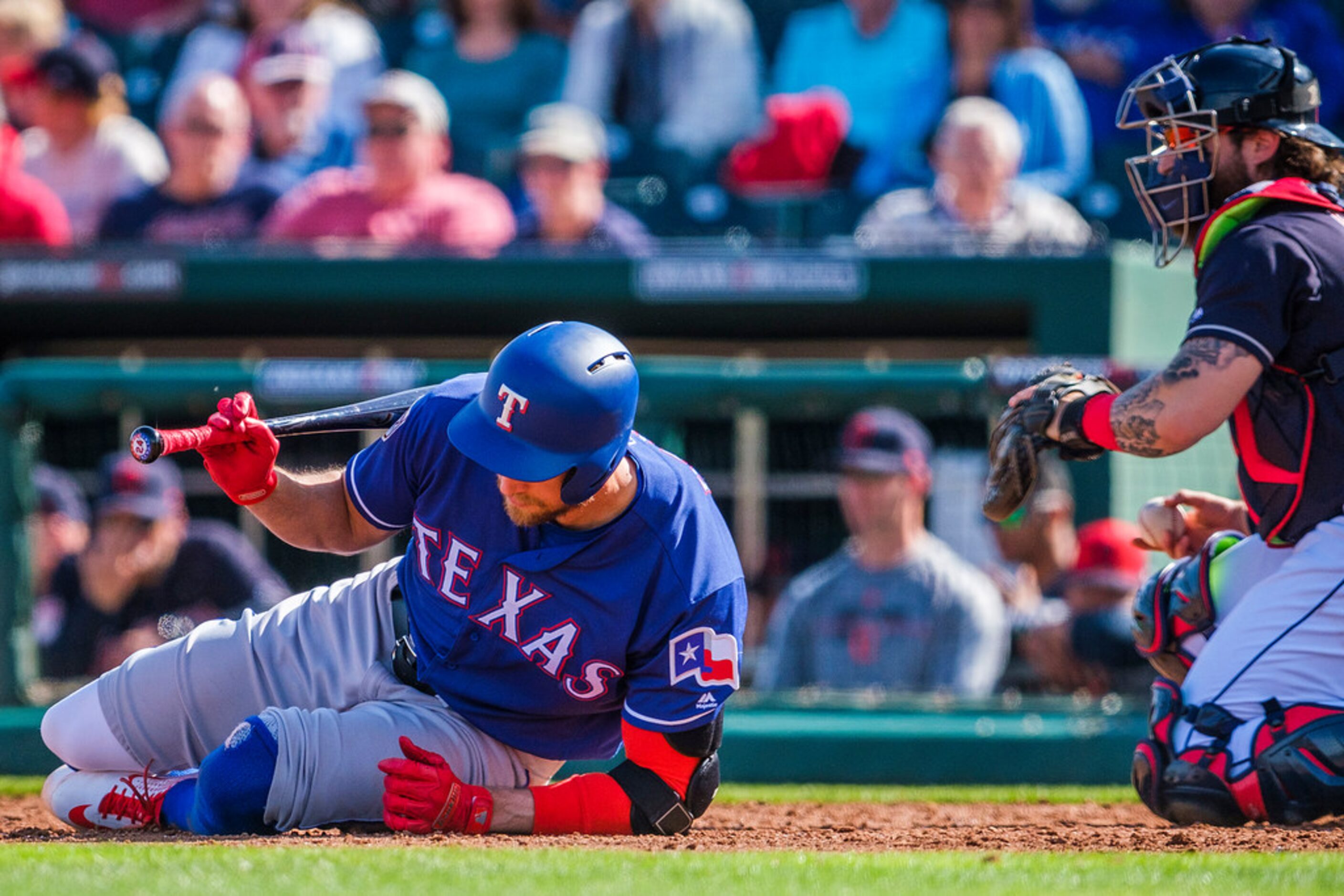 Texas Rangers outfielder Hunter Pence hits the dirt after spinning away from an inside pitch...