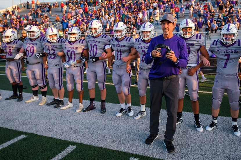 Mount Vernon high school football coach Art Briles lines up on the sideline before his...