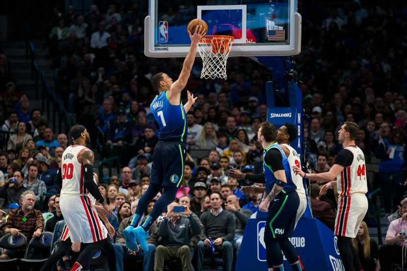 Dallas Mavericks forward Dwight Powell (7) goes up for a basket during the third quarter of...
