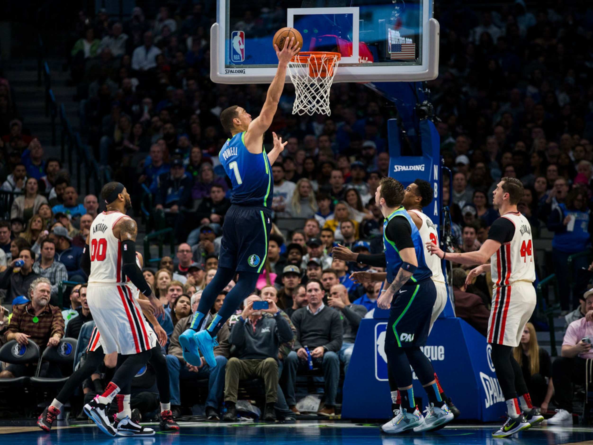 Dallas Mavericks forward Dwight Powell (7) goes up for a basket during the third quarter of...