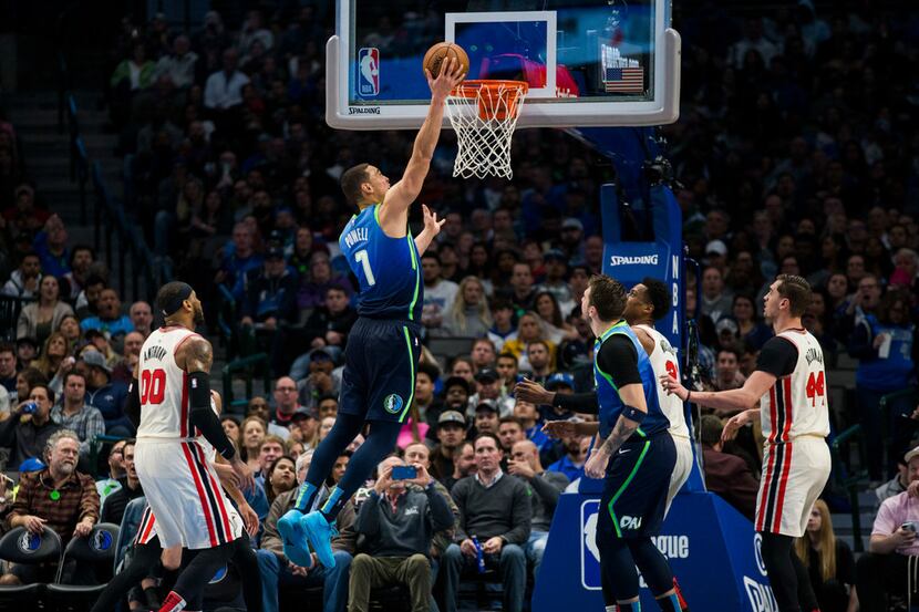 Dallas Mavericks forward Dwight Powell (7) goes up for a basket during the third quarter of...