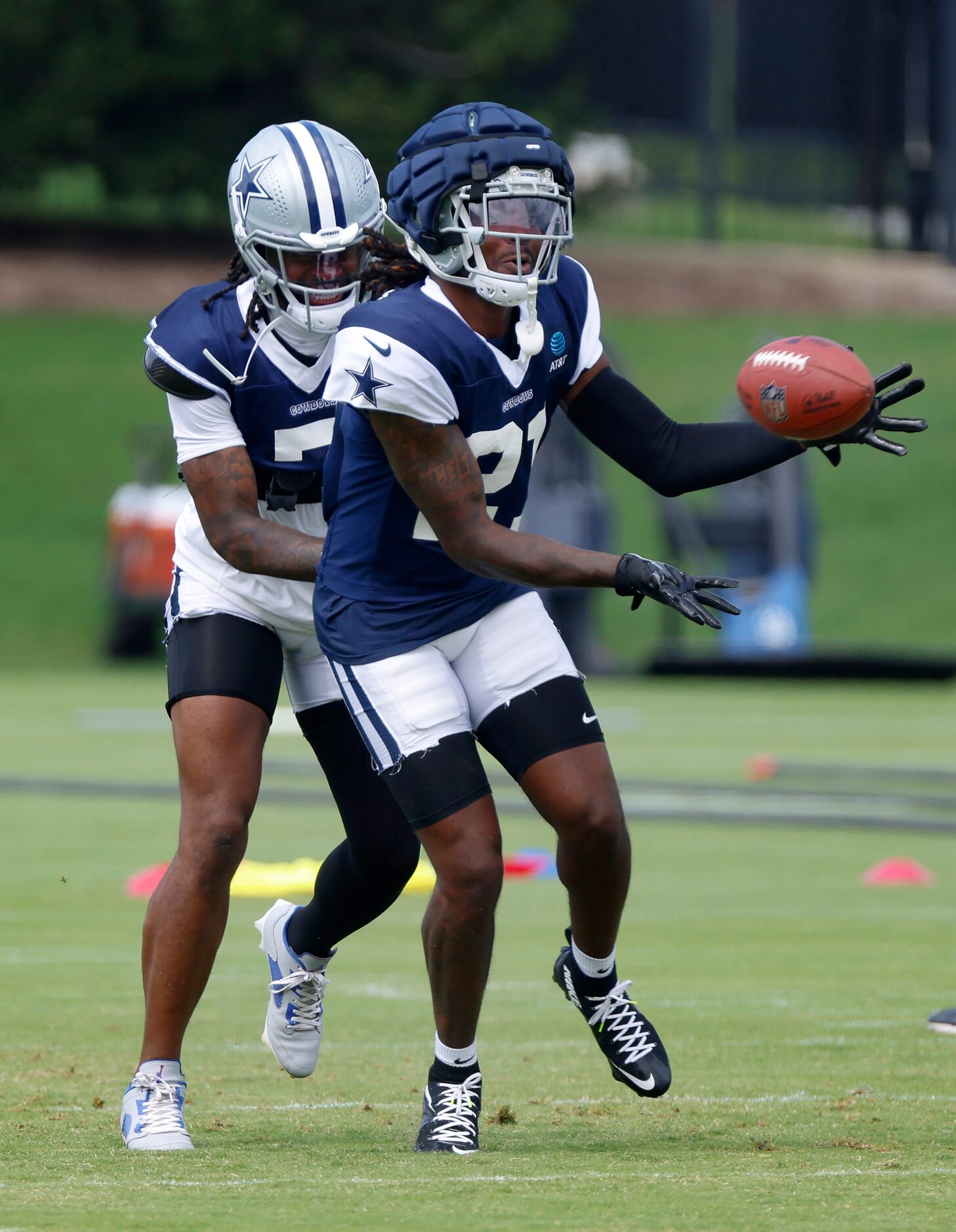 Dallas Cowboys cornerbacks Caelen Carson (21) and cornerback Trevon Diggs (7) battle for a...