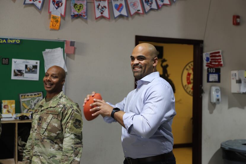 Rep. Colin Allred, D-Dallas, throws a football at Camp Arifjan in Kuwait. Allred visited the...