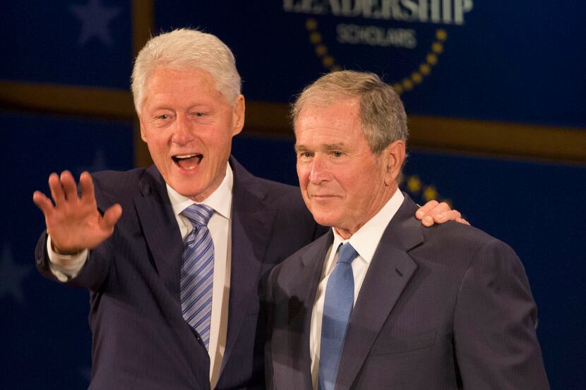 Former Presidents George W. Bush and Bill Clinton wave during the Presidential Leadership...