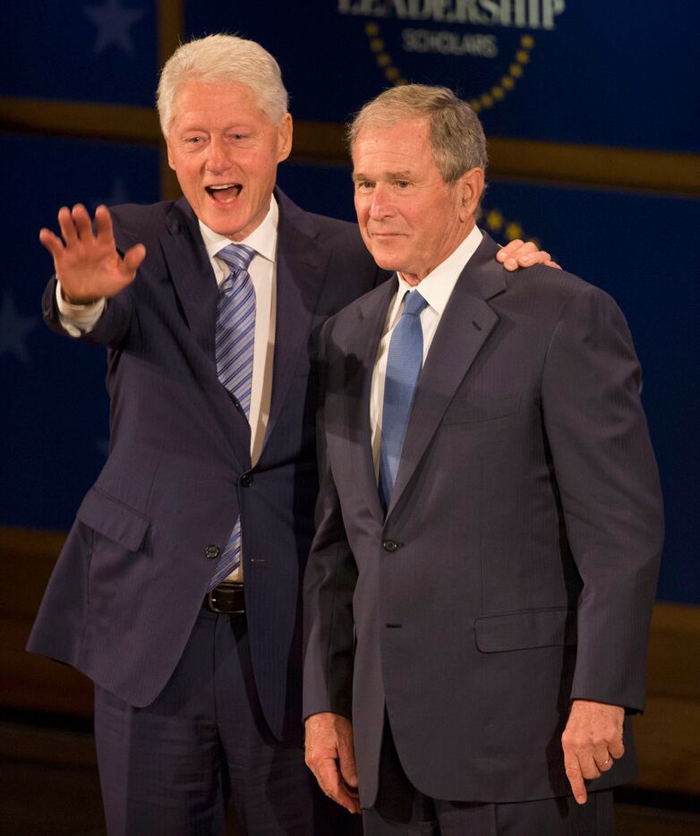 Former Presidents George W. Bush and Bill Clinton wave during the Presidential Leadership...
