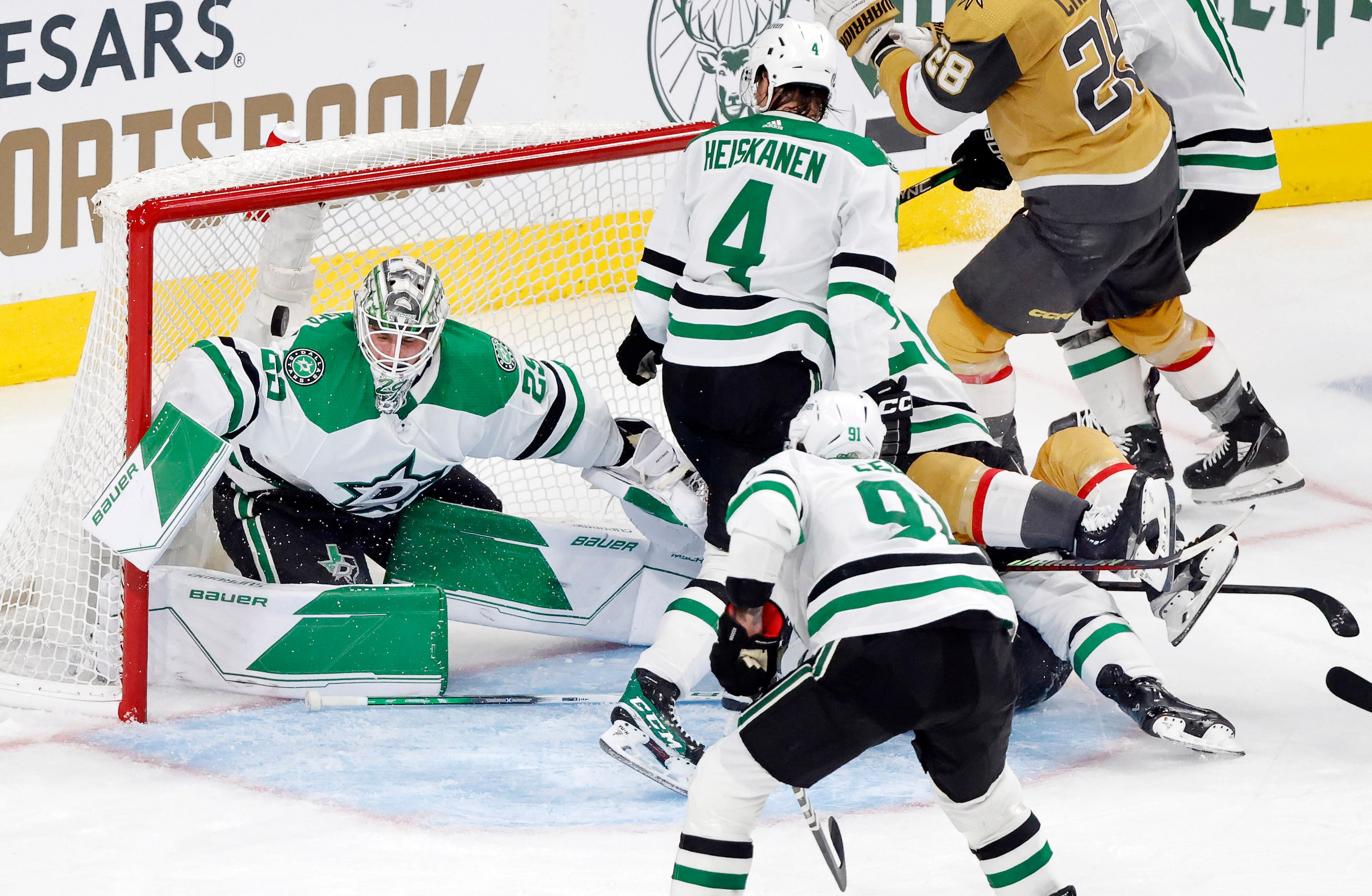 Dallas Stars goaltender Jake Oettinger (29) lets a rebound shot get past him by Vegas Golden...