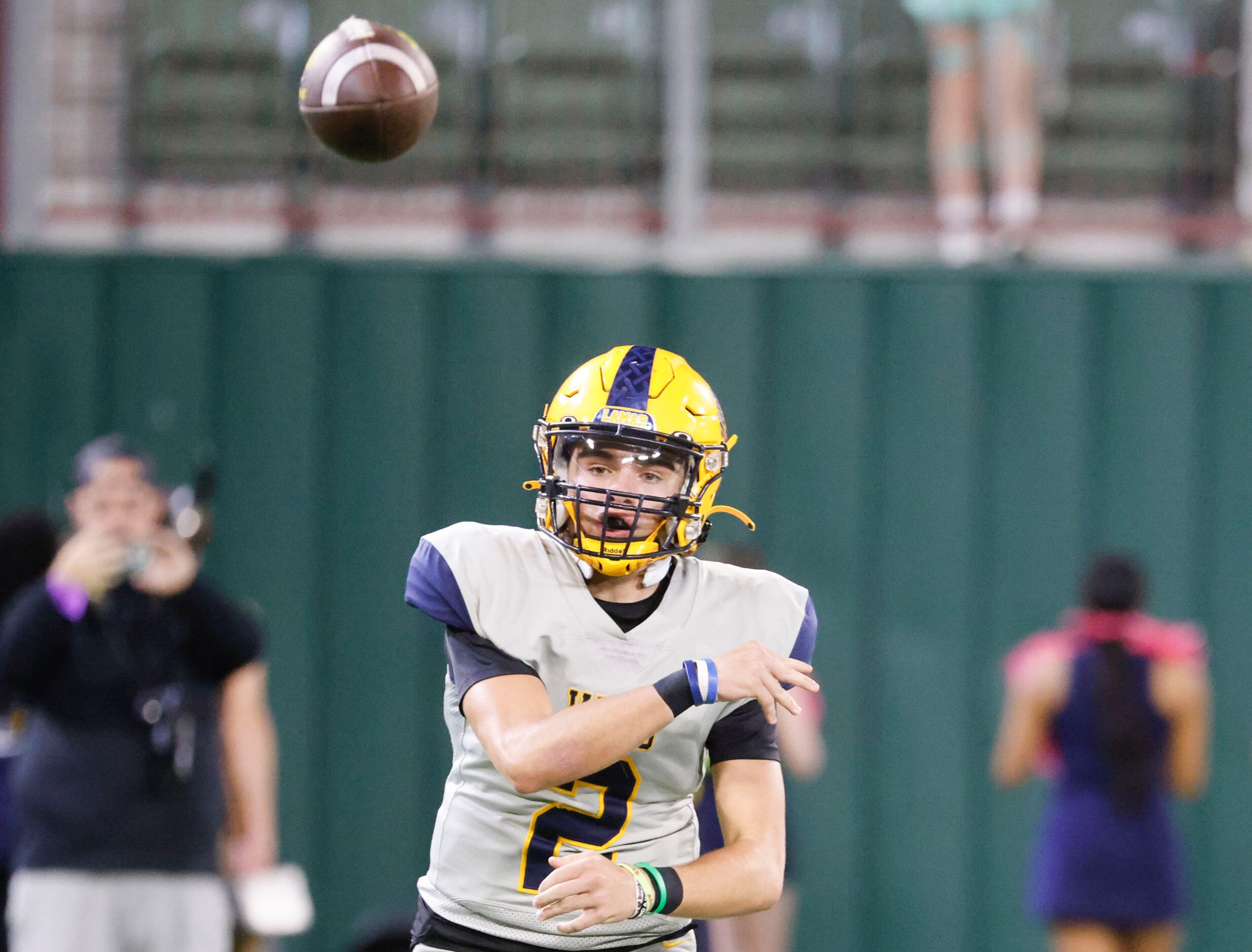 Lamar High’s QB Gannon Carey throws the ball against James Bowie high during the first half...