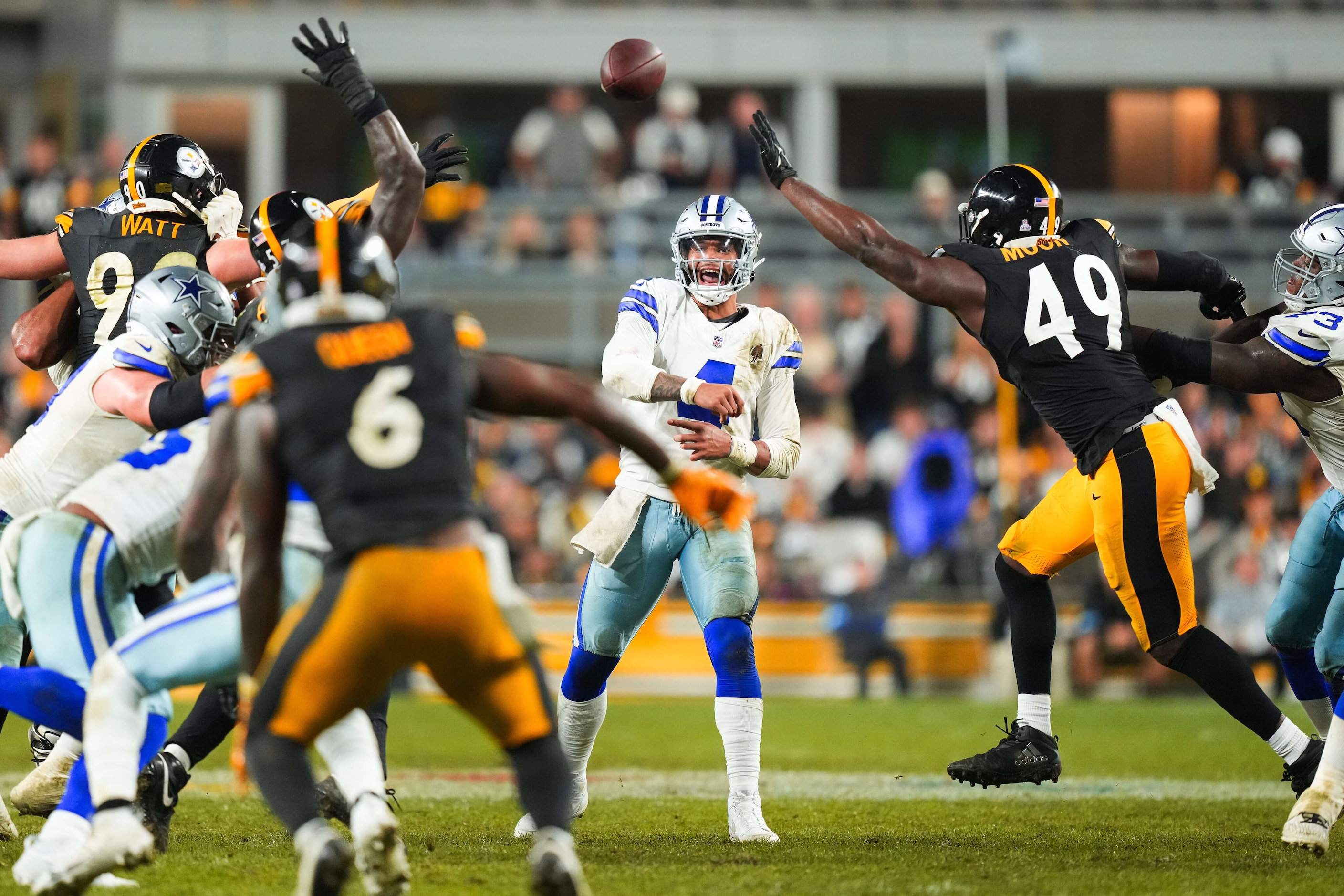 Dallas Cowboys quarterback Dak Prescott (4) throws a pass under pressure from Pittsburgh...