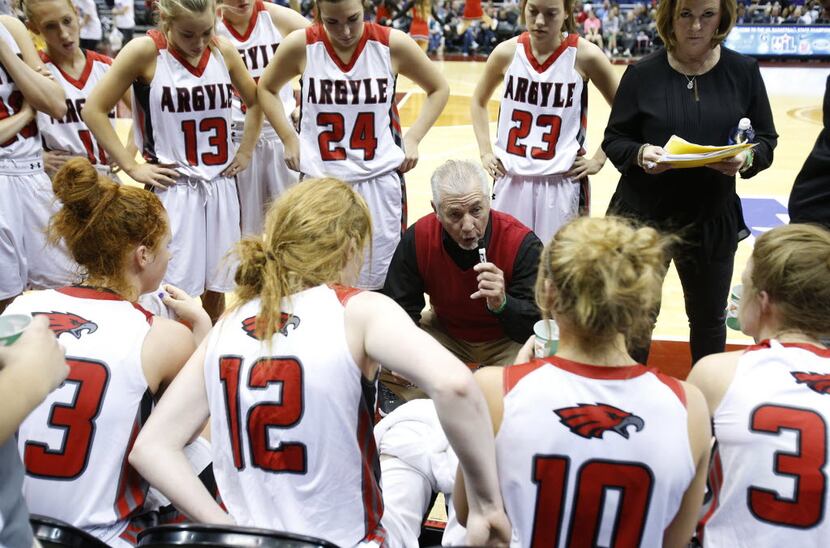 Argyle's head coach Skip Townsend speaks to his team during the UIL Girls State Basketball...