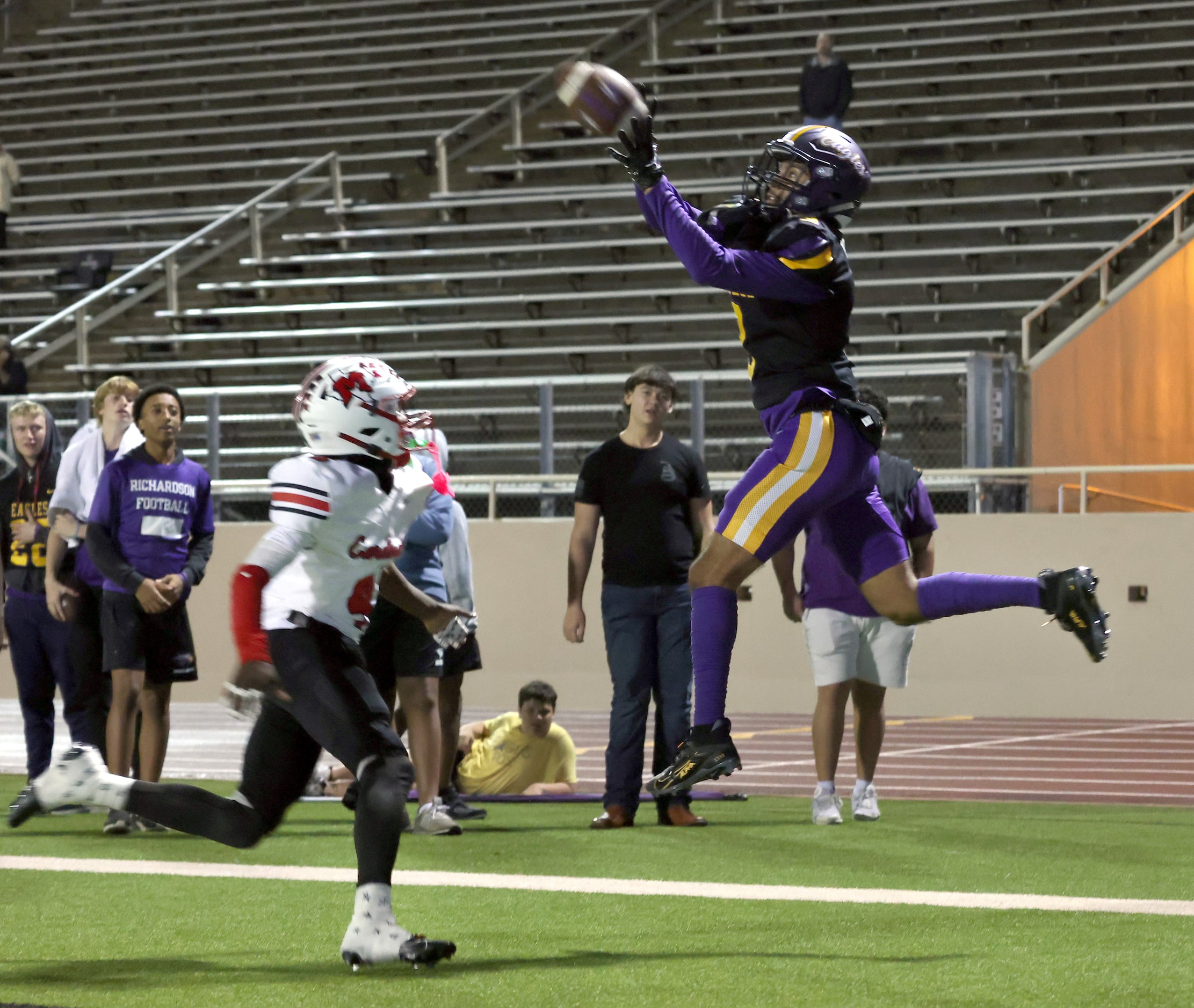 Richardson receiver Evan Tabora (3) leaps to pull in a second quarter touchdown pass as he...