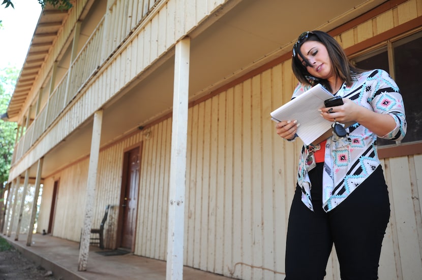 Child Protective Services caseworker Catherine Eberhardt calls in a report to her supervisor...