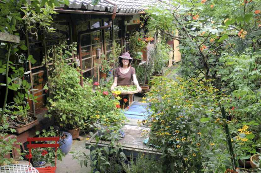 Venetia Stanley-Smith works in her garden growing seasonal flowers in Kyoto, Japan, in this...
