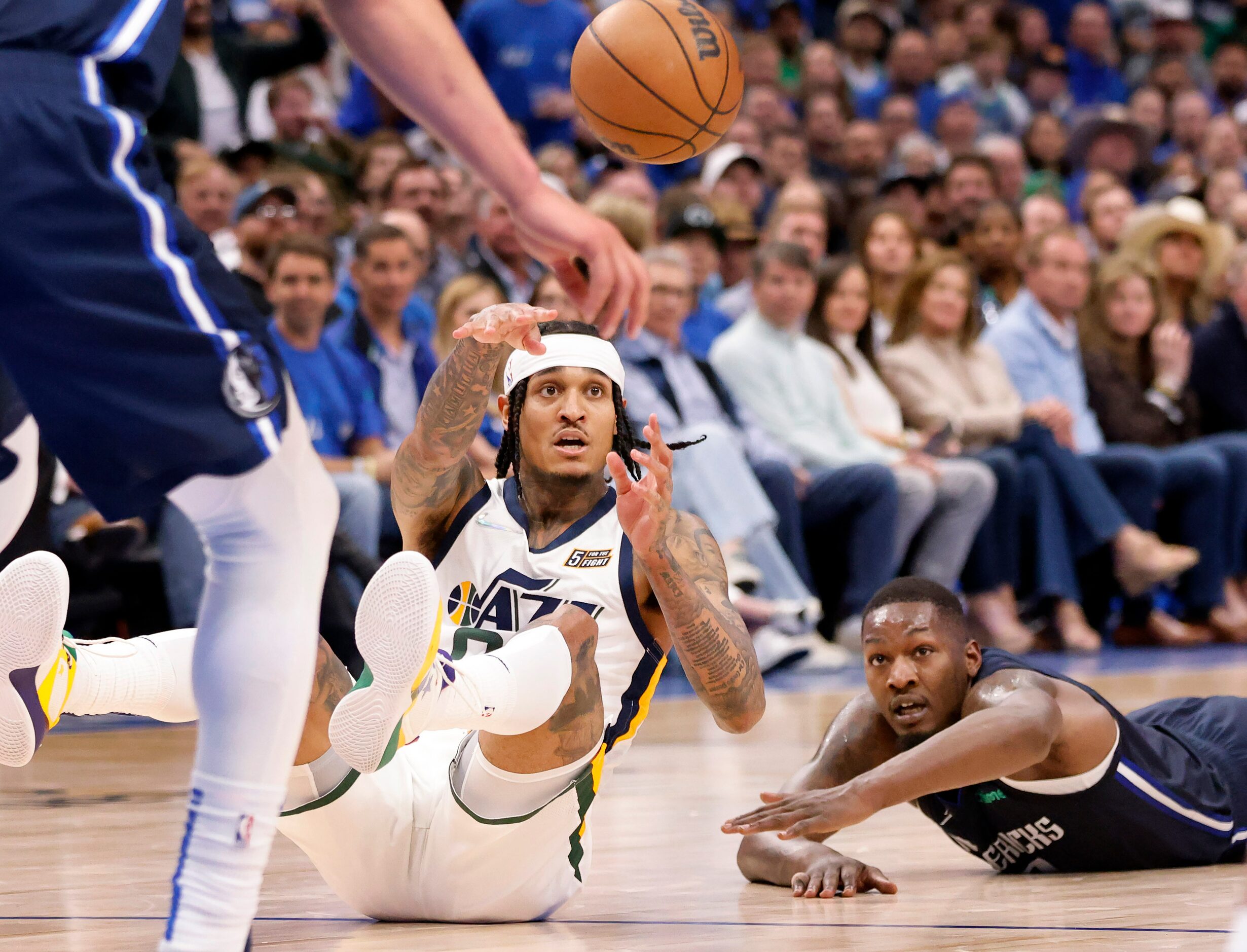 Utah Jazz guard Jordan Clarkson (00) passes the ball after scrambling for it with Dallas...