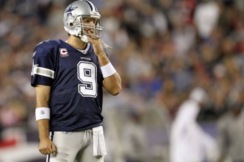 Dallas Cowboys quarterback Tony Romo (9) looks towards the scoreboard in the second half of...