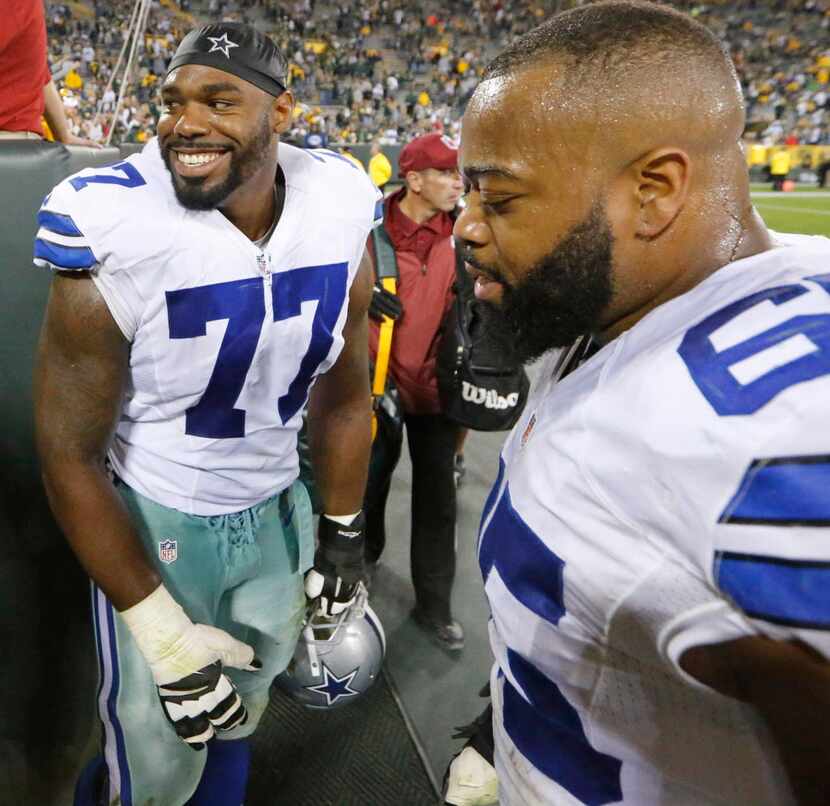 Dallas Cowboys tackle Tyron Smith (77) and Dallas Cowboys guard Ronald Leary (65) leave the...