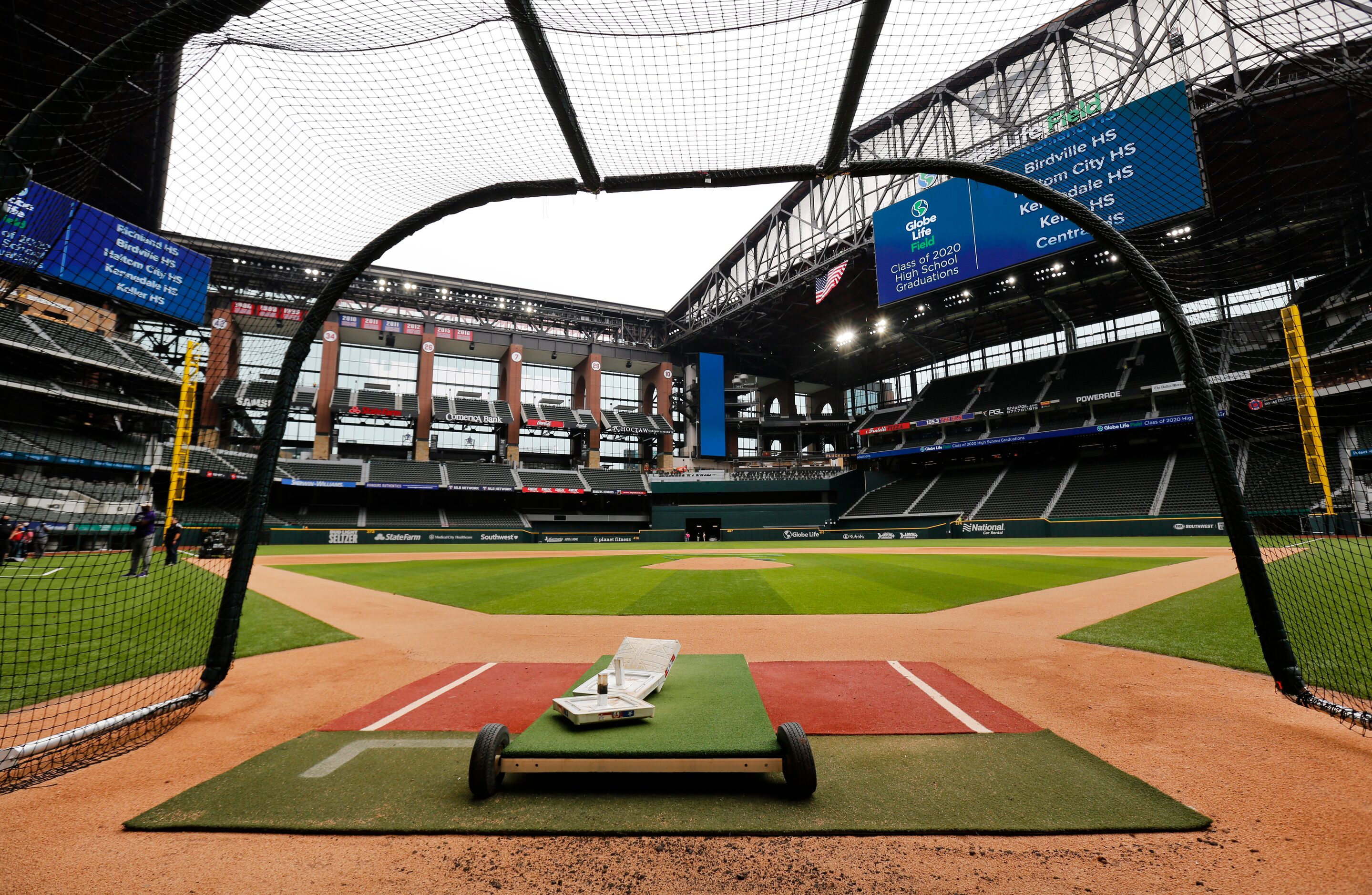 Texas Rangers players have been using a batting cage on the field of the newly completed...