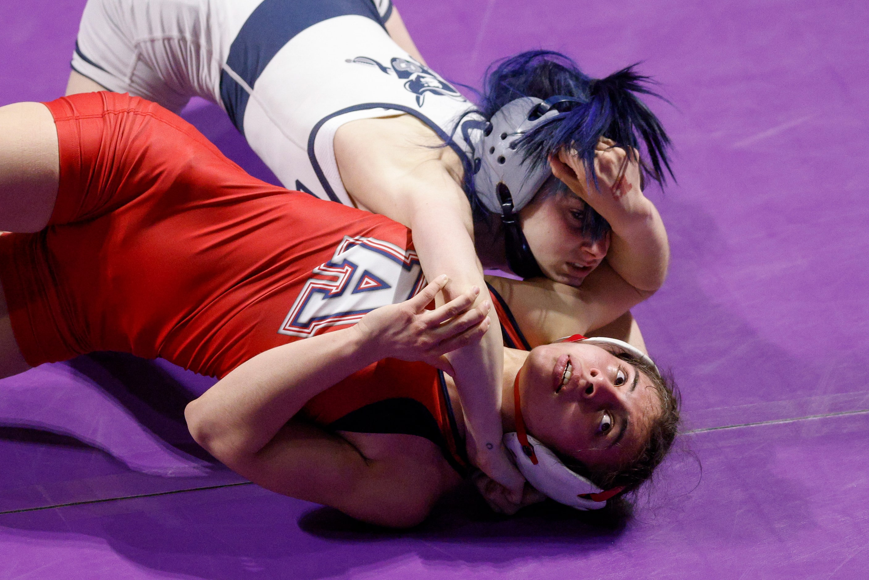 Olivia Degeorgio of Conroe Woodlands College Park (top) wrestles Eliana Martinez of Allen...