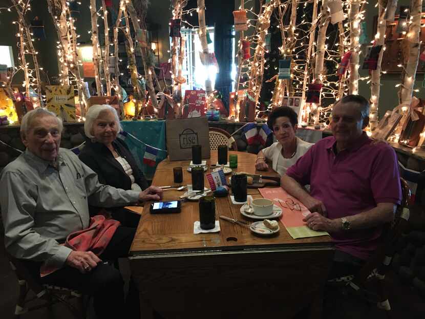 Sidney Achée, Elizabeth Ingram, Carmen Achée and Robert Achée dining at a restaurant. Sidney...