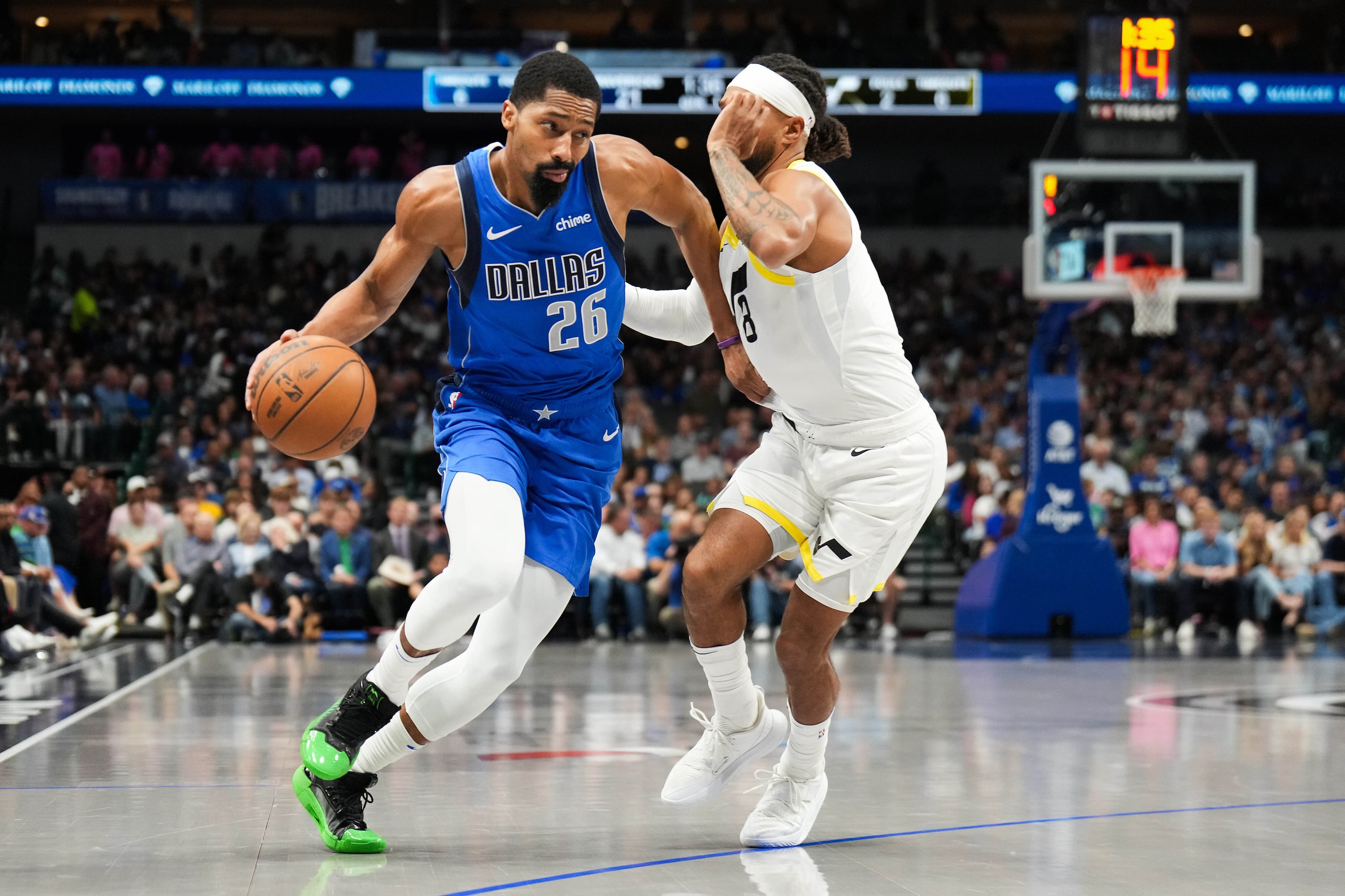 Dallas Mavericks guard Spencer Dinwiddie (26) is defended by Utah Jazz guard Patty Mills (8)...