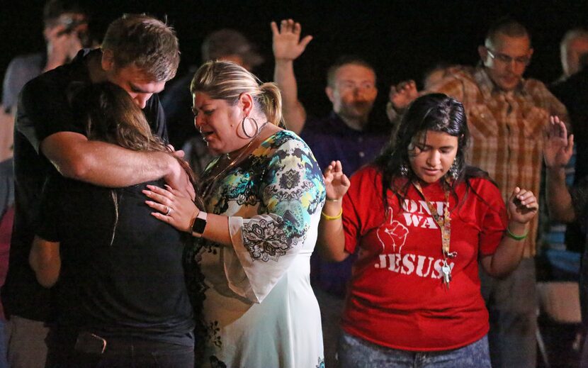 Emotions run high at a memorial service held Nov. 6, 2017, at the baseball field in...