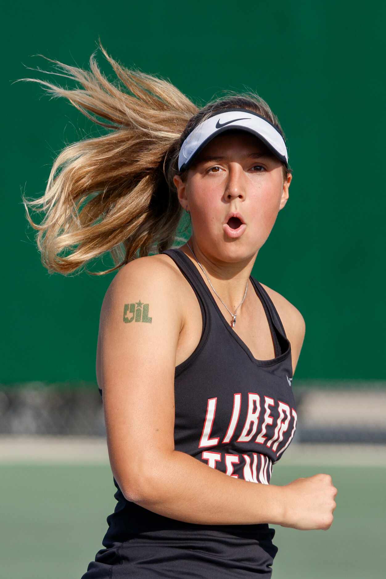 Frisco Liberty’s Milla Dopson celebrates after a point during the 5A mixed doubles...
