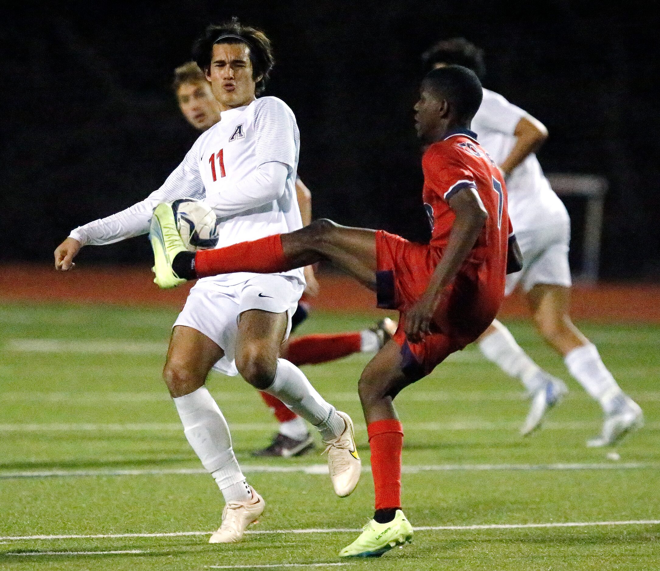 McKinney Boyd High School forward Nissim Pingue (7) gets control of the soccer ball in front...