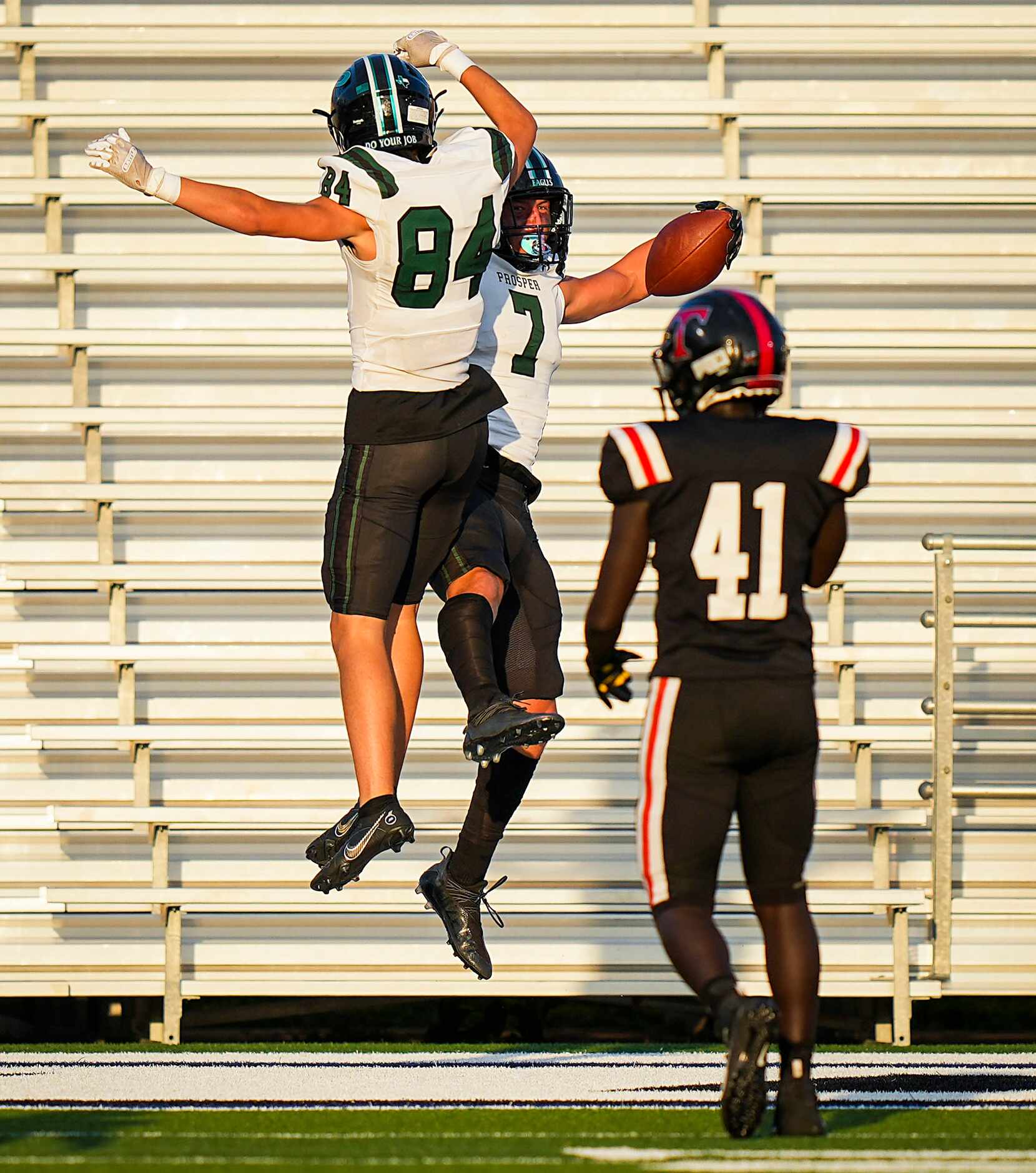 Prosper wide receiver Brayden Rymer celebrates a touchdown with Josh Kennedy (84) during the...