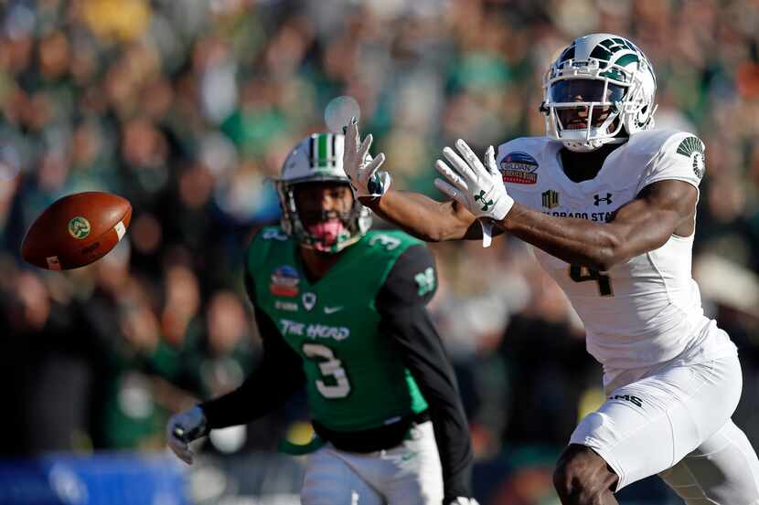 Colorado State wide receiver Michael Gallup (4) misses a reception as Marshall defensive...