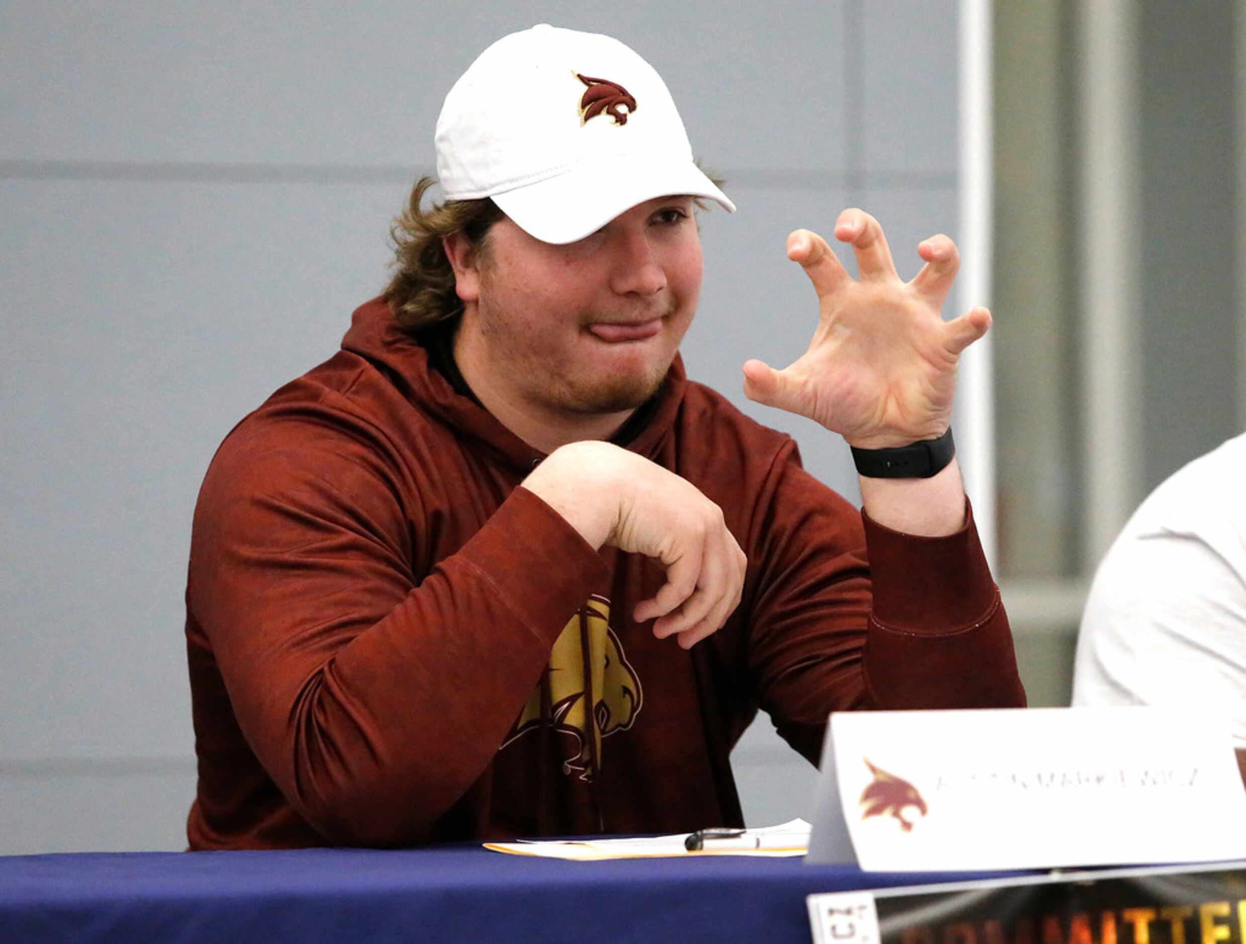 Austin Markiewicz flashes the Texas State spirit sign during the National Signing Day...