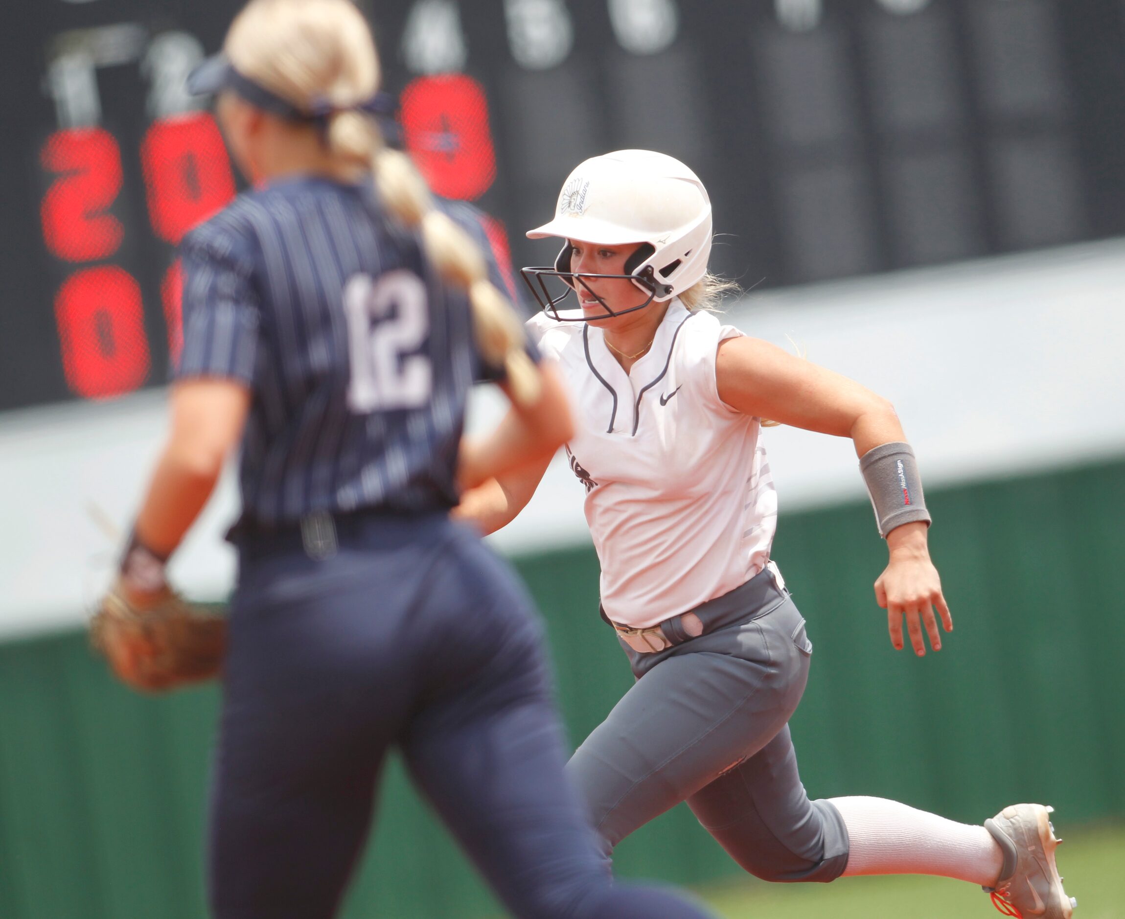 Keller's Mackenna Jackson (8) sprints around the bases to score from first base on a single...