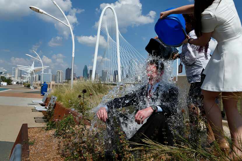 Dallas County Judge Clay Jenkins accepts the ALS ice bucket challenge, photographed August...