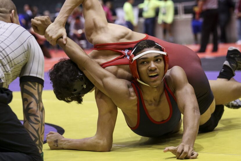 Allen High School's 138 pounder Juwan Robinson ­grapples with Anthony Navarrete ­of Amarillo...