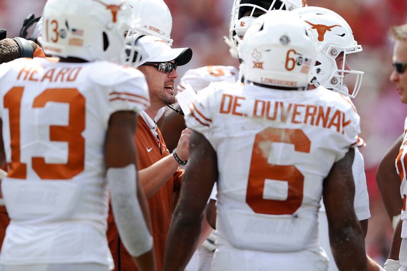 Texas Longhorns head coach Tom Herman talks to his team during a break in play during the...
