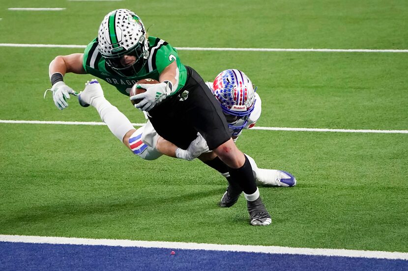 Southlake Carroll running back Owen Allen (2) scores past Austin Westlake defensive back...