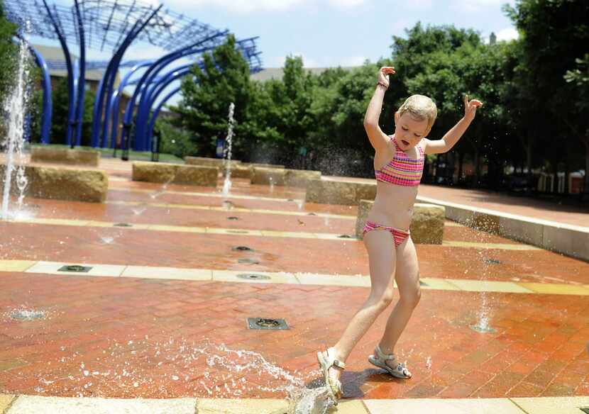 Kids can play in the fountains at Addison Circle Park