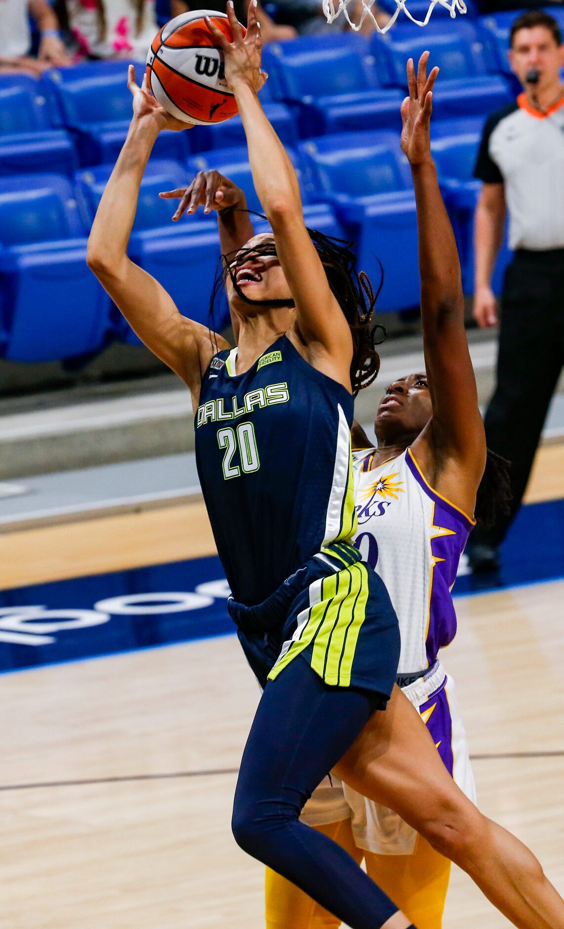 Dallas Wings forward Isabelle Harrison (20) goes for a shot in the second quarter against...