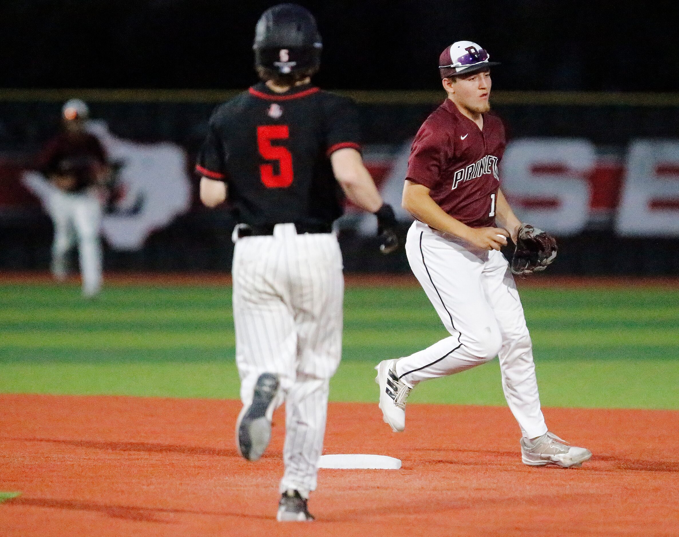 Princeton High School shortstop Chad Kyle (10) forces out Lovejoy High School base runner...